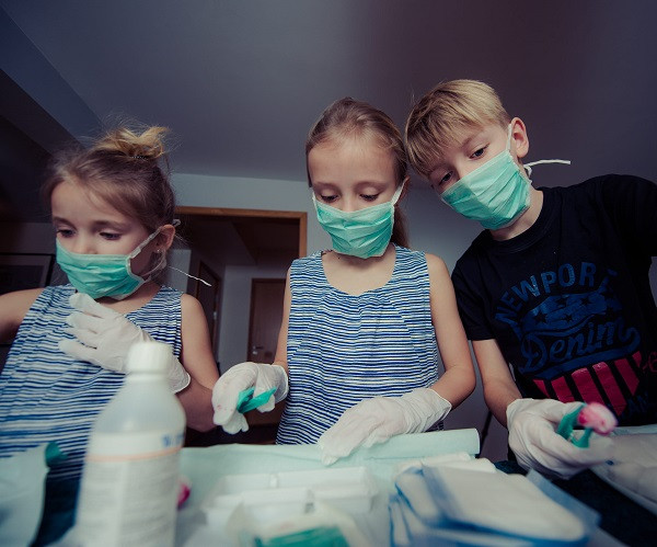 Three Children Wearing Face Masks in uihere cco