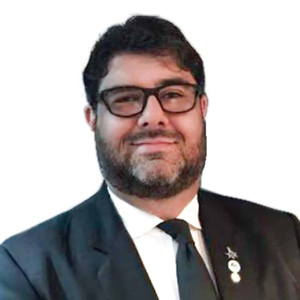 Un hombre con traje y lentes eca00a79